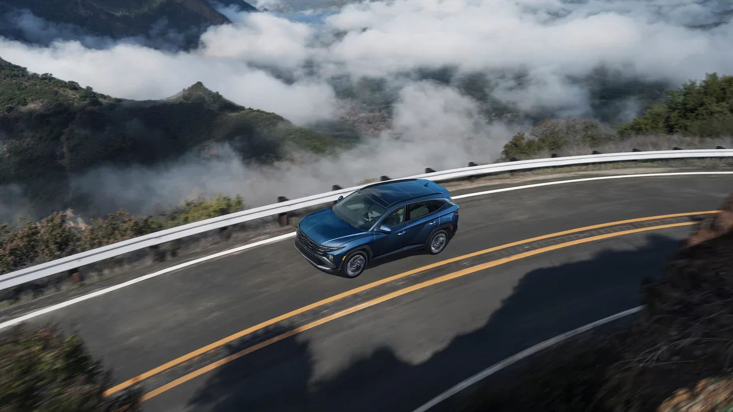 2025 Hyundai Tucson - Performance 2025 Hyundai Tucson driving on a mountain road from above