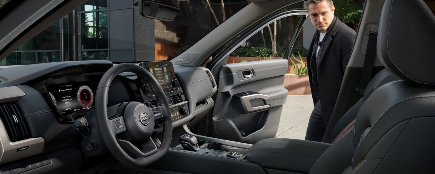 Man getting in a 2025 Nissan Pathfinder