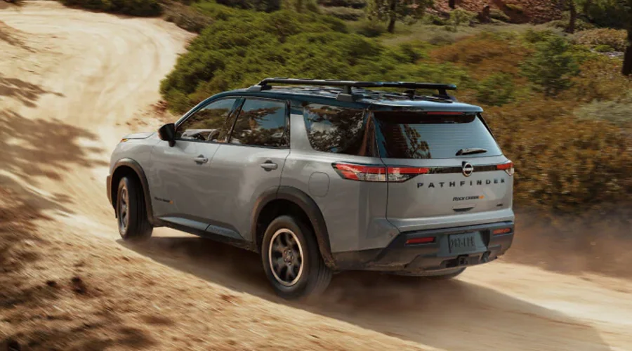 2025 Nissan Pathfinder driving on a dirt road