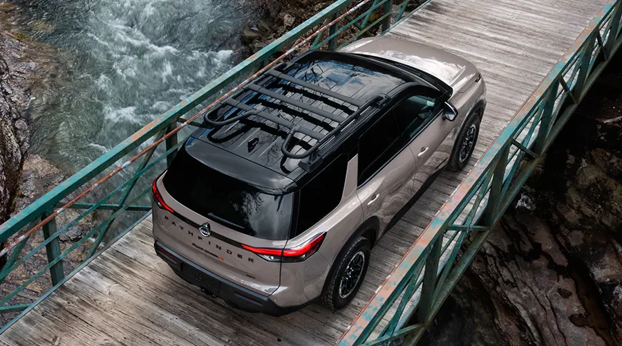 2025 Nissan Pathfinder Driving over a bridge