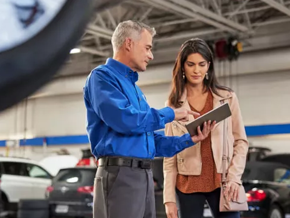 VW Service Tech with a customer